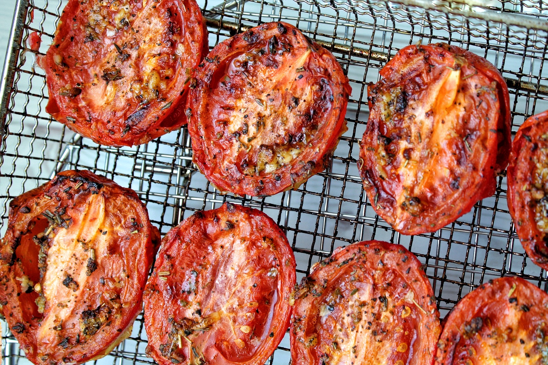 Roma tomatoes roasted on an air fryer rack