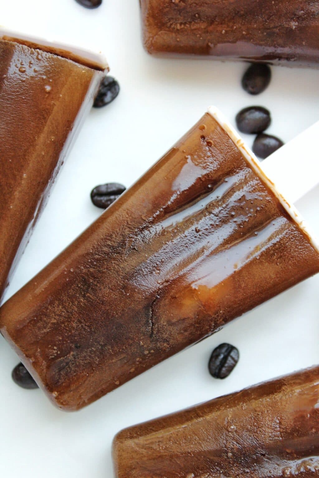 Close up of coffee popsicle with whole coffee beans