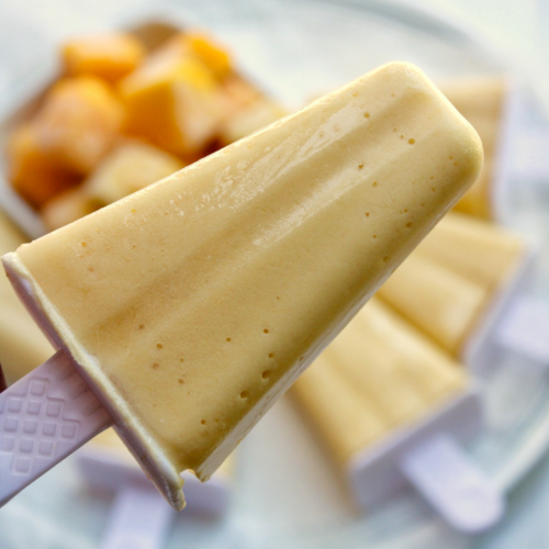 Mango coconut popsicle with frozen mangoes.
