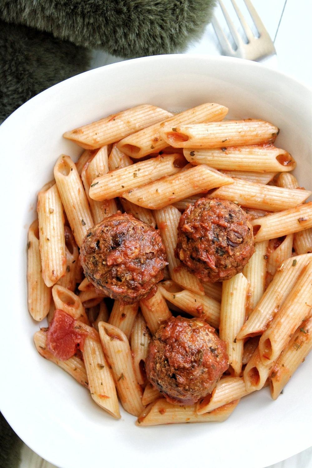 Veggie lentil meatballs with penne pasta in a bowl 