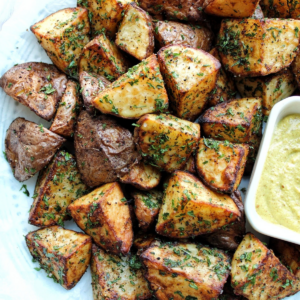 Air fryer red potatoes with herbs and sideof sauce