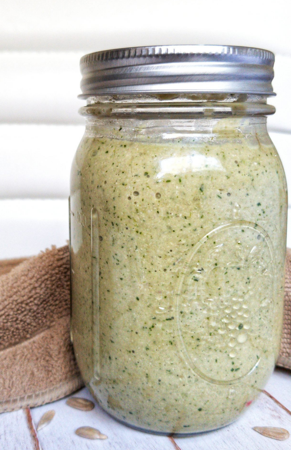 Creamy cilantro sauce in a canning jar.