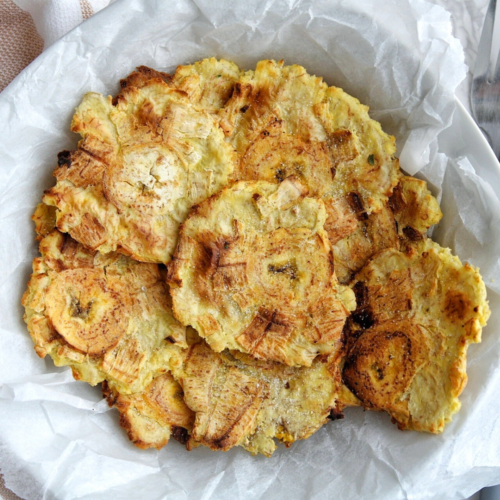 Air fryer tostones in a white bowl.