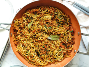 Meatless Puerto Rican spaghetti topped with chopped cilantro.