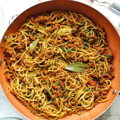 Meatless Puerto Rican spaghetti topped with chopped cilantro.