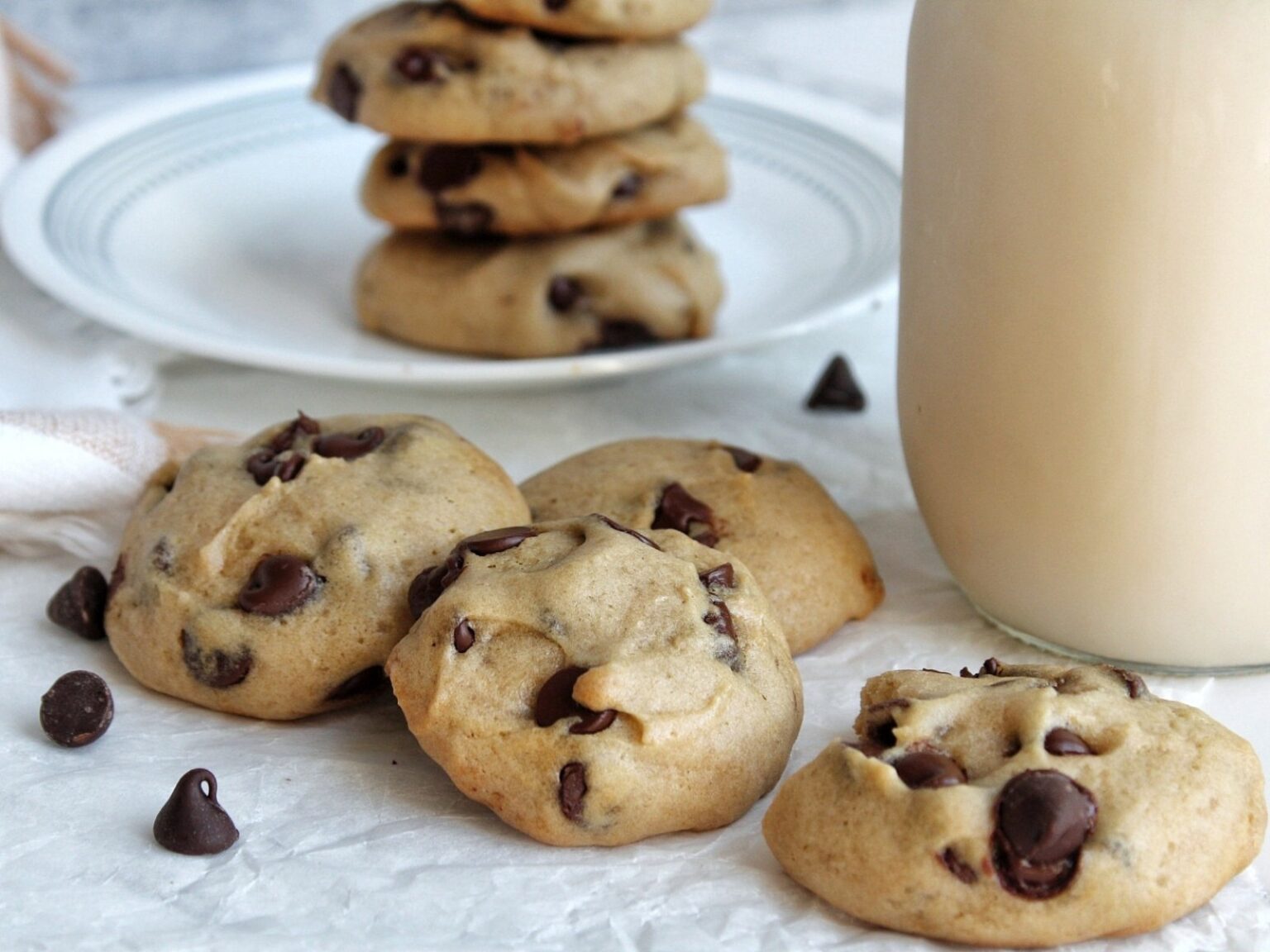 Chocolate chip cookies with a jar of vegan milk. 