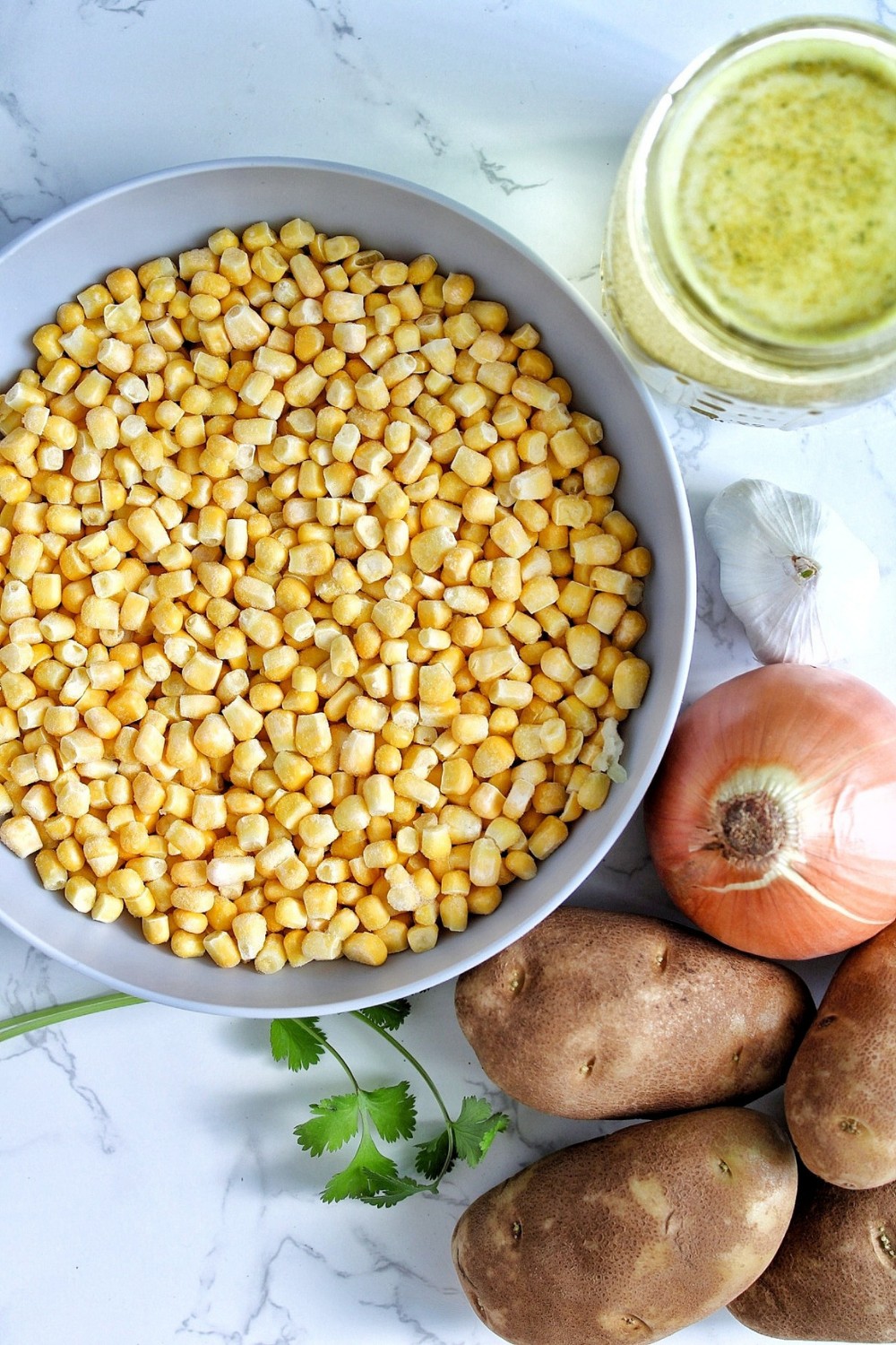 Frozen corn, veggie broth, onion, garlic, potatoes, cilantro. 