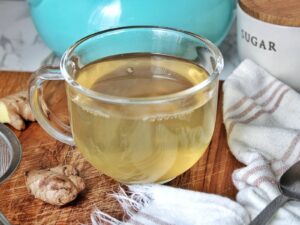 Clear tea mug with homemade ginger root tea.