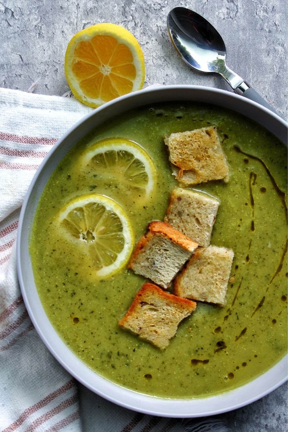 Zucchini soup in a gray bowl.