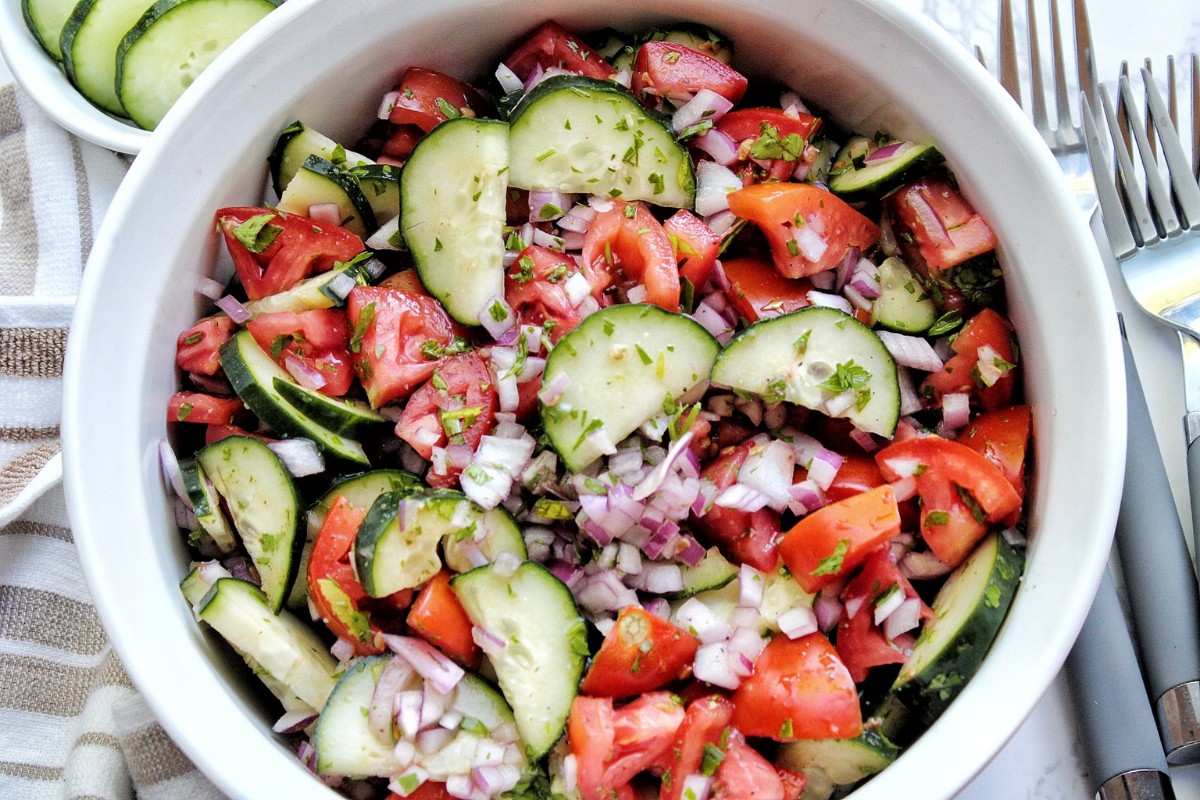 Cucumber tomato salad in a serving bowl.