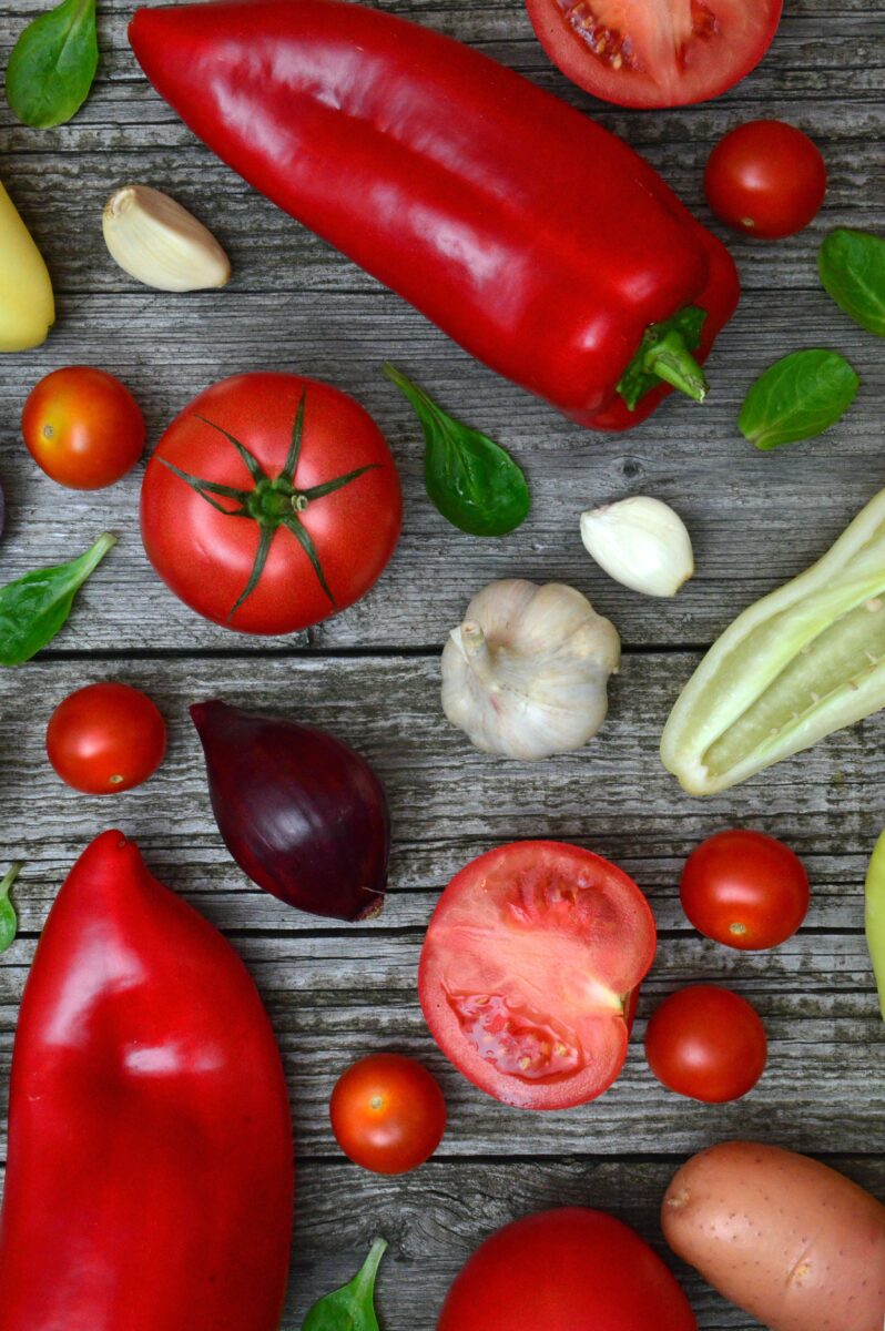 Various vegetables against a wooden backdrop. 