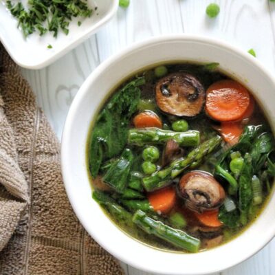 Bowl of spring soup with vegetables.