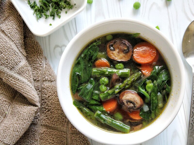 Bowl of spring soup with vegetables.