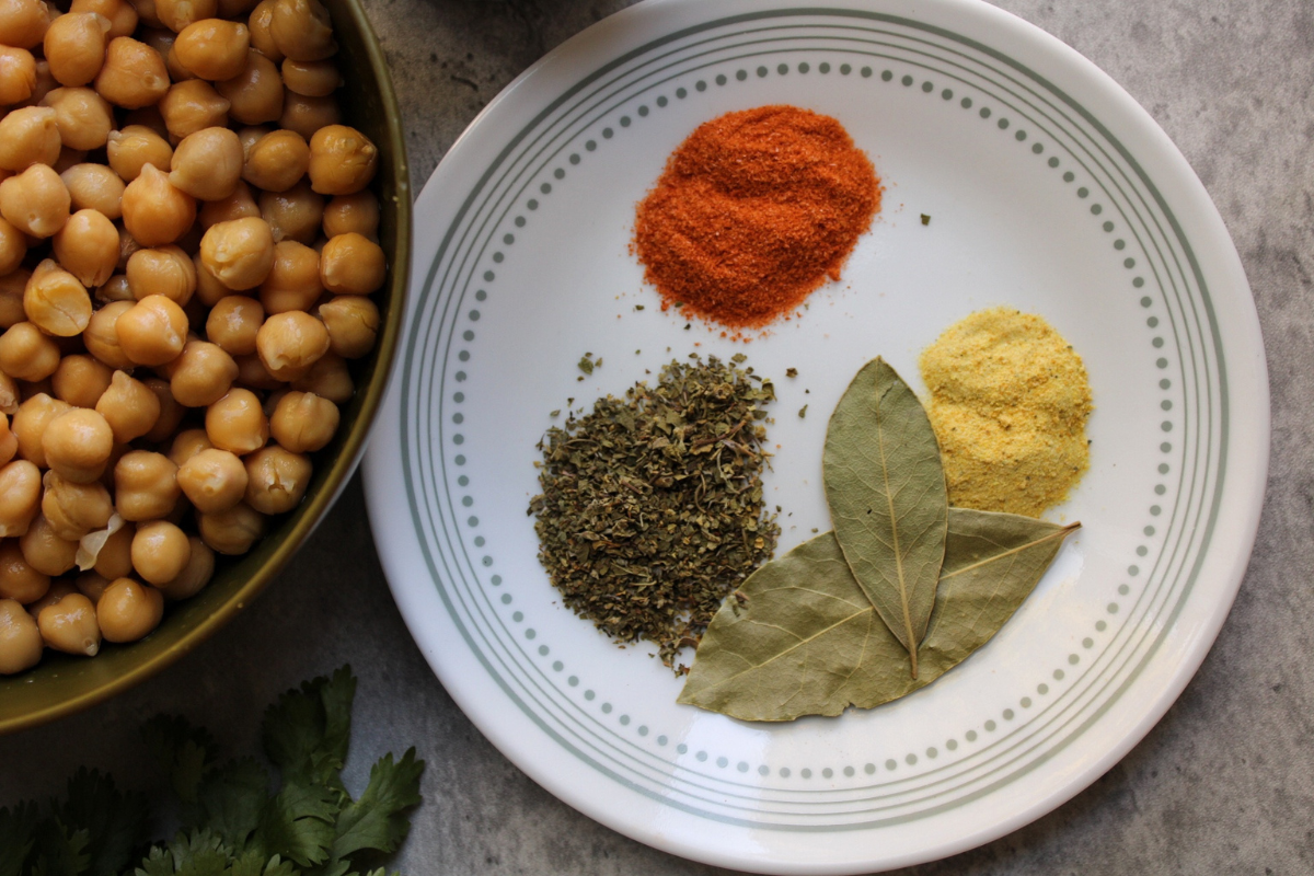 Puerto Rican spices and a bowl of chickpeas. 