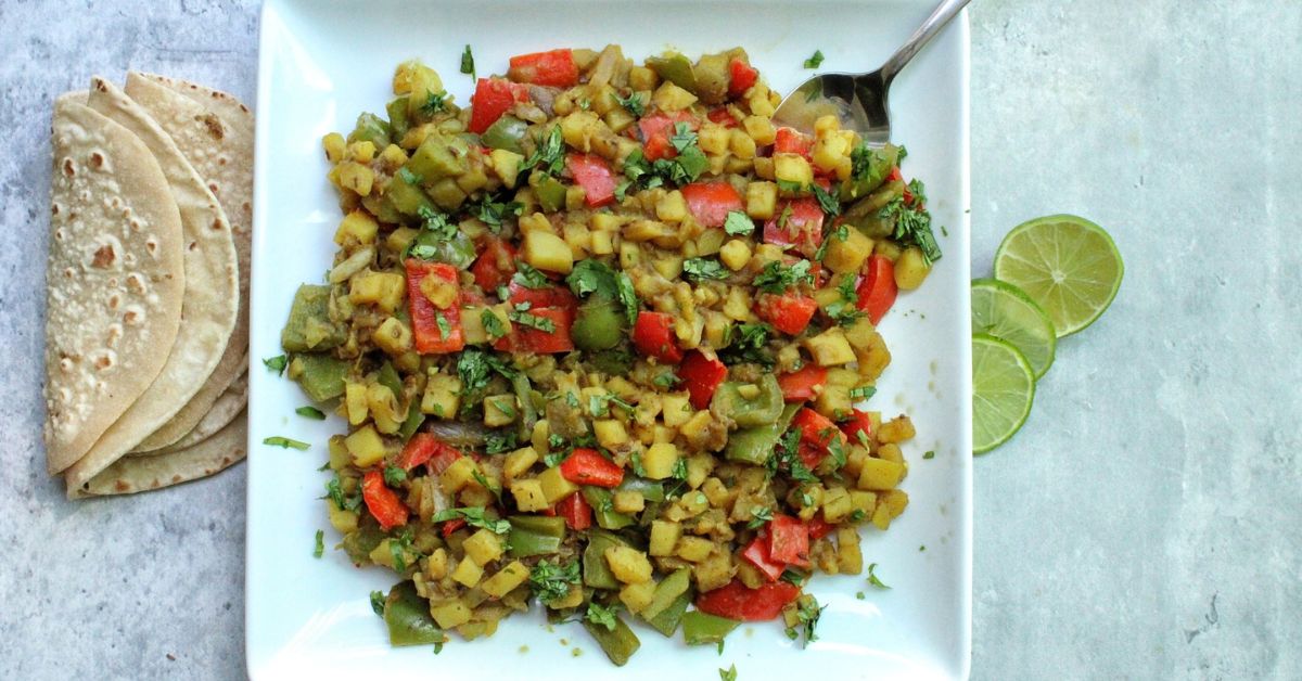 Aloo Capsicum with roti and lime slices. 