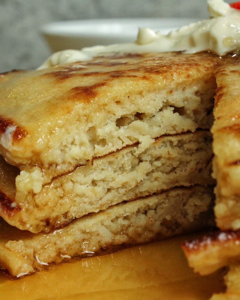 Fluffy whole wheat pancakes texture shown inside.