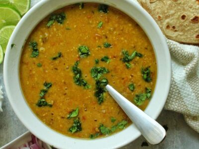 Red lentil soup (Masoor dal) garnished with cilantro.