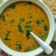 Red lentil soup (Masoor dal) garnished with cilantro.