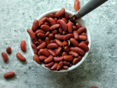 Small bowl of uncooked red kidney beans.