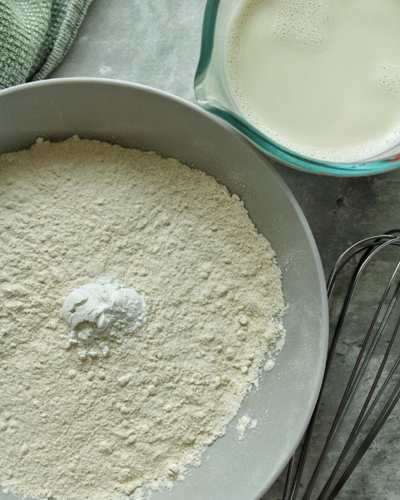 whole wheat flour and baking powder in a bowl. 
