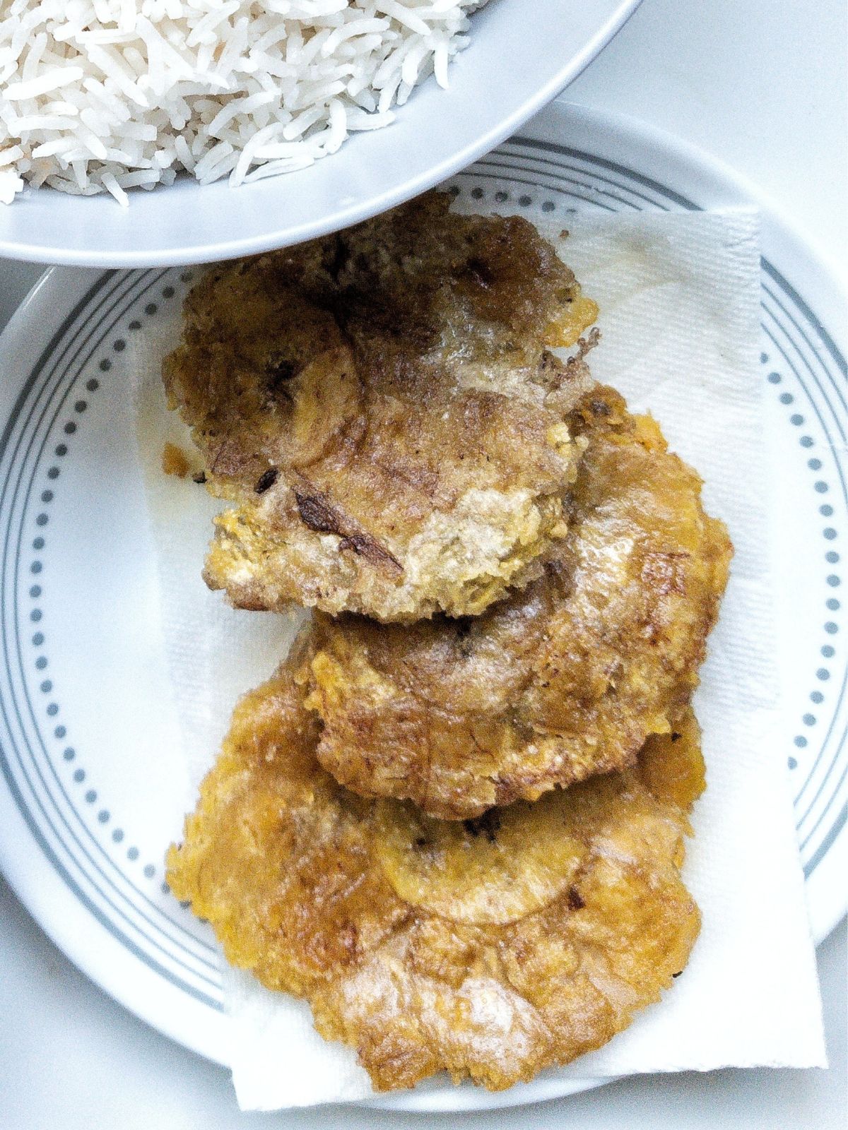 Tostones or fried, unripe plantains. 