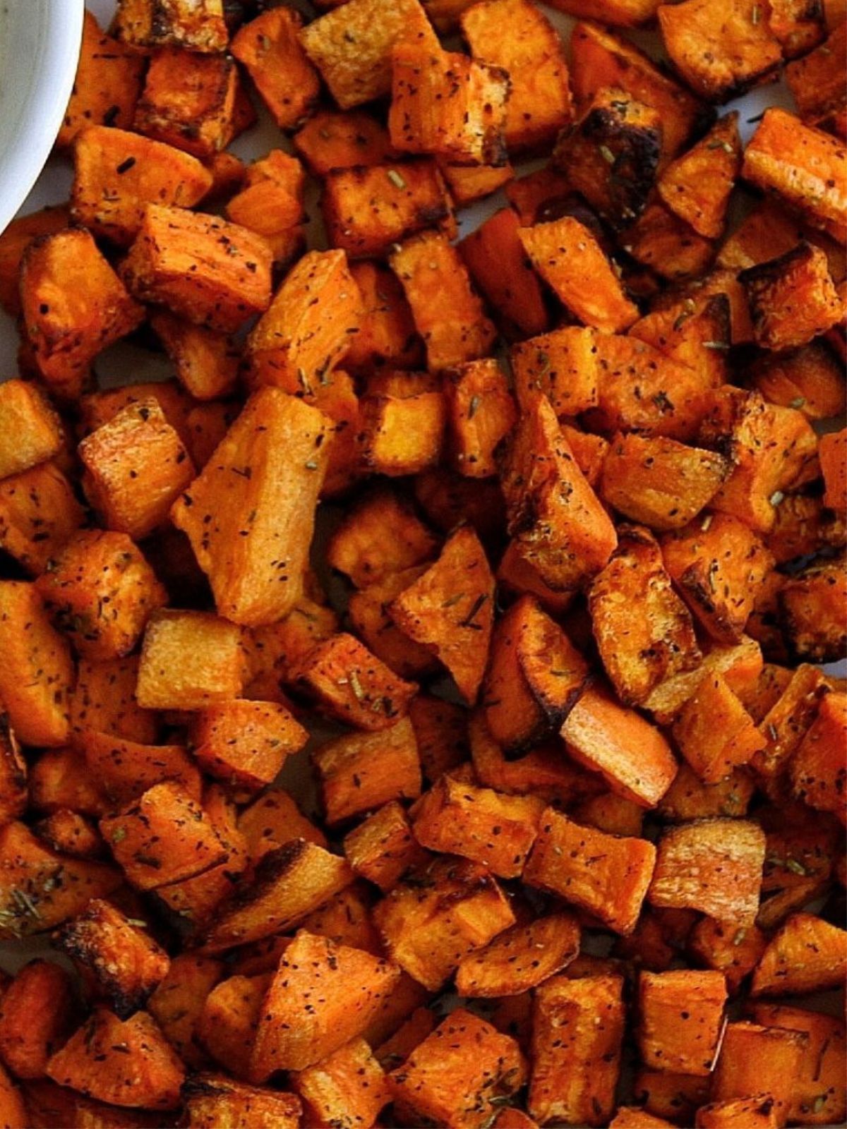 Close up cooked air fryer sweet potato cubes. 