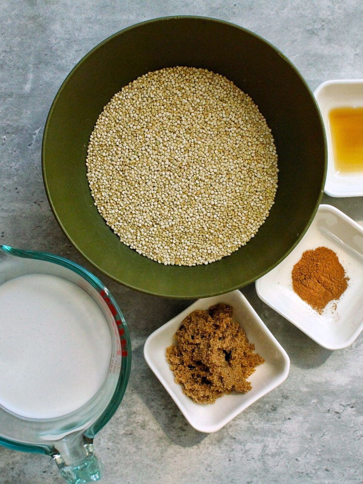 Ingredients for quinoa porridge: white quinoa, coconut milk, brown sugar, cinnamon, maple syrup. 